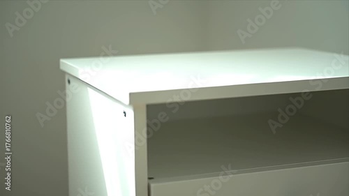 Wallpaper Mural Close Up of Sleek White Modern Minimalist Nightstand or Side Table with Open Storage Shelf and Drawer Ideal for Contemporary Home Interior Design Torontodigital.ca