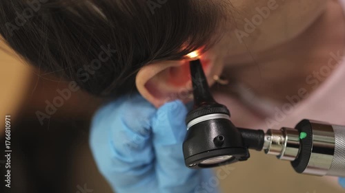 ENT doctor. Ear examination. Doctor's appointment. Slow motion. Vertical video. High quality 4k footage