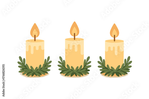Three burning holiday candles with dripping wax surrounded by green festive foliage decoration