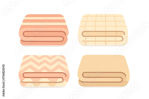 Set of four folded bath towels in pastel colors with various patterns