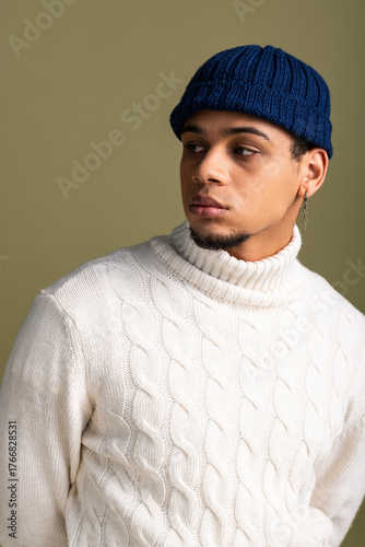Wallpaper Mural Handsome young man shows off stylish winter outfit with confidence in trendy hat Torontodigital.ca