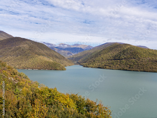 A beautiful view of zhinvali reservoir near Tbilisi city in Georgia. The scene is peaceful and serene, with the mountains in the background