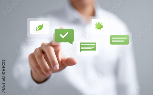 Focused man touching digital screen interface with green icon. Technology concept with check mark in bubble for approval, communication and business success