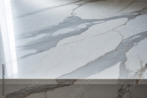 Elegant white marble surface with grey veins and a polished reflective finish