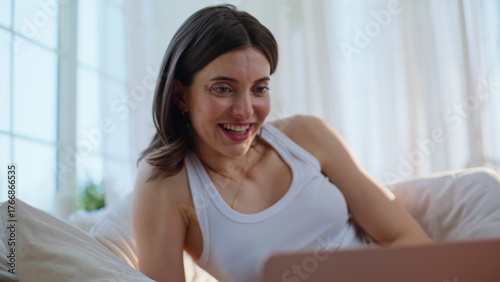 Brunette talking virtual meeting by laptop relaxing in comfortable bed closeup. Free Download Brunette talking virtual meeting by laptop relaxing in comfortable bed closeup. - GFXLoad