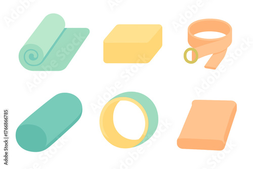 Set of essential fitness and yoga accessories including rolled mat foam roller and resistance band