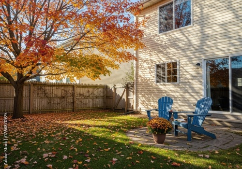 Photo of a backyard of a townhouse on a sunny autumn day in a soft sunset light