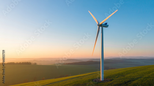 Wind turbines with soft golden light, symbolizing renewable energy and sustainability
