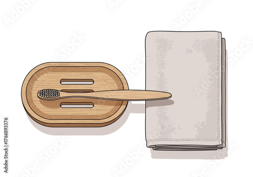 A bamboo toothbrush on a wooden holder rests beside a neatly folded stack of towels