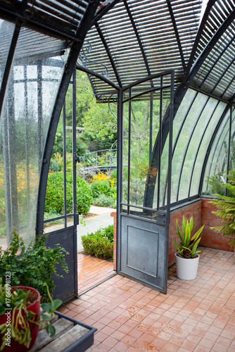 The open door leads to the garden from the veranda