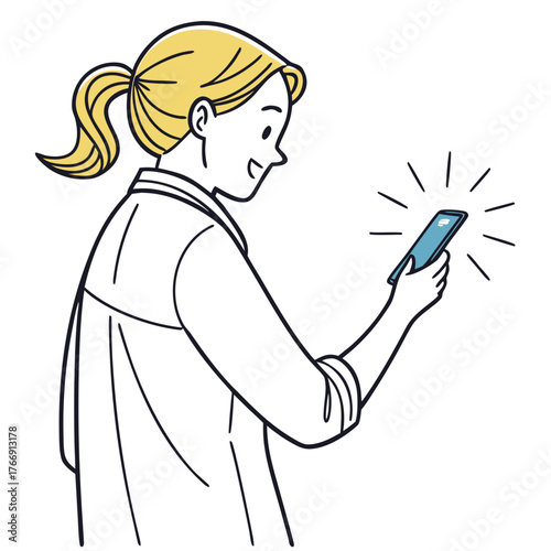 Young woman smiling while looking at her smartphone