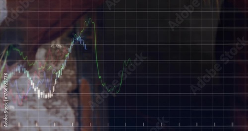 Upon chewing hay, cow muzzle pulling strands while digital grid and graphs tracing feed trends