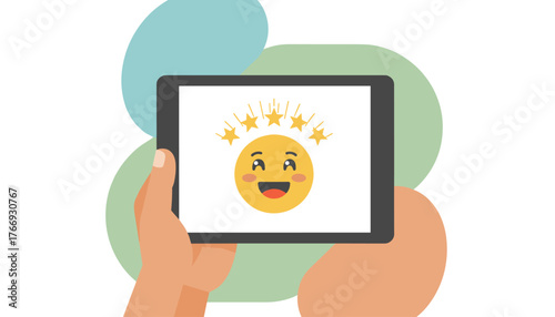Close-up of a hand holding a tablet displaying a happy emoji with five golden stars above, representing excellent service rating and customer satisfaction, perfect for online reviews and feedback