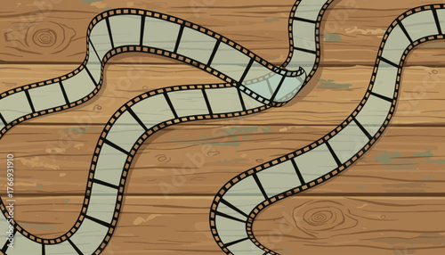 A vintage film strip gracefully curves across a rustic, weathered wooden background, its perforations and frames clearly visible, evoking a sense of nostalgia and the art of filmmaking.
