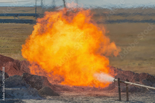 The Arctic gas source. Combustion of reservoir fluid during well testing and development. The bright flame of the torch as a symbol of energy and the elements bursts out of the bowels