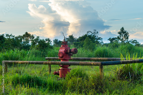 Abandoned oil well, economy of an oil-producing country.