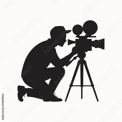 Vector icon of a cameraman silhouette kneeling behind a professional movie camera mounted on a tripod for filming