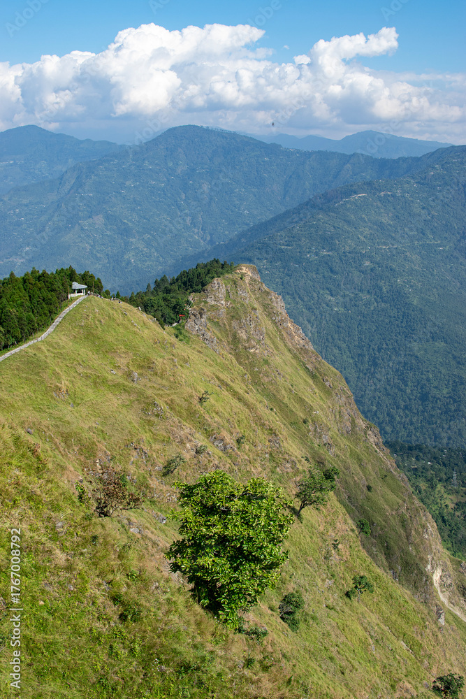 Naklejka premium Tarey Bhir point,favourite tourist spot, Sikkim,India. A long path on the hills, a breathtaking viewpoint at the end of the edge, tourists get spectacular view of Himalayan mountains in front of them.