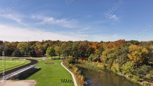 Aerial Drone View of Glen Ellyn Park and River in Fall with Colorful Autumn Trees A stunning aerial drone view of Glen Ellyn, Illinois, capturing a park and winding river surrounded by vibrant autumn