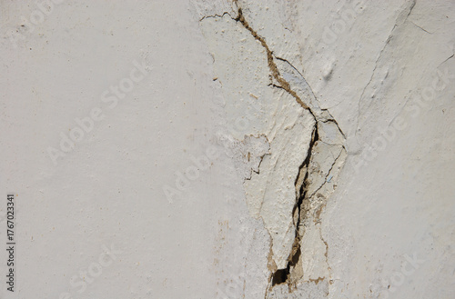 old wall background. 
crack on white whitewashed wall background