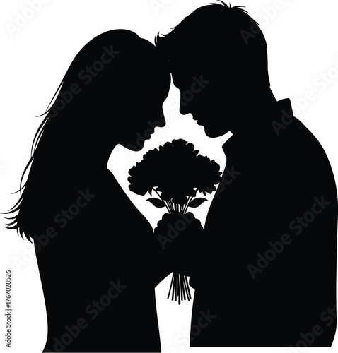 Silhouette of a loving couple embracing tenderly with a bouquet of flowers in between them