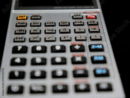 A handheld electronic vintage calculator with an LCD display and 42 keys. It was manufactured in Japan and was a popular model among students and technicians in the 1980s.