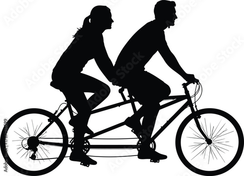 Silhouetted couple riding a tandem bicycle together enjoying an outdoor activity