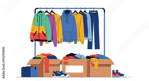 Colorful casual clothing displayed on a portable rack and neatly packed into cardboard boxes, with a duffel bag and sneakers, indicating donation or organization.