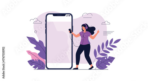 Young woman wearing headphones and dancing to music from her smartphone, enjoying a moment of leisure.