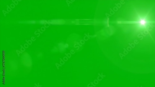 Ethereal green lens flare slowly drifting against a solid green screen for visual effects dreamy, video element, design