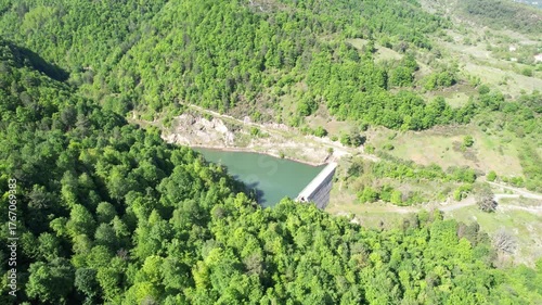 Aerial shot of a freshwater dam in the forest