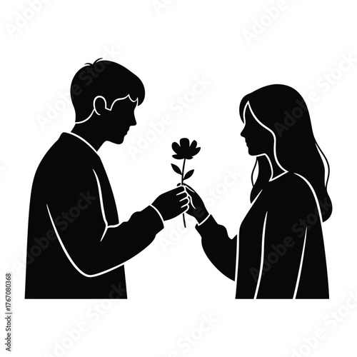 Silhouette of a man offering a single flower to a woman in a romantic gesture of love and affection