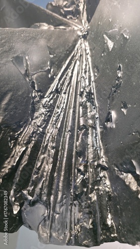 Clear cracked stained hand blown glass artwork abstract background