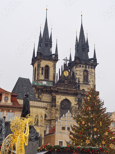 Wallpaper Mural Historic Gothic church towers rise above festive Christmas decorations in Prague's Old Town Square Torontodigital.ca