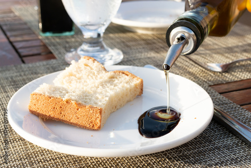 Starter plate of bread with olive oil and balsamic vinegar at an Italian restaurant, close-up. 