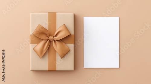 personalized clipboard gift Gift box with a bow beside a blank card on a soft beige background.