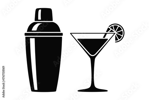Cocktail shaker and martini glass with lime slice