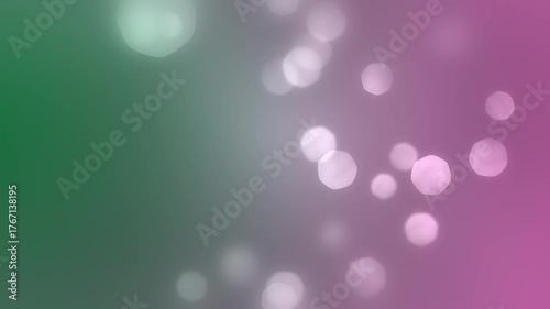 Abstract bokeh background with green and pink colors.