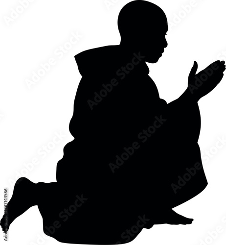 Black silhouette monk praying kneeling meditation