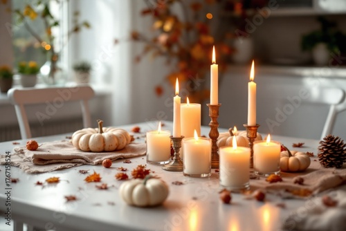 Cozy dining table scene with lit candles, pumpkins, and fall decor