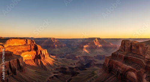 The Grand Canyon at sunset, with the Colorado River flowing through the canyon's depths.