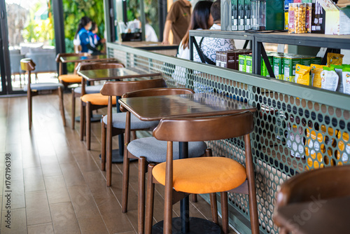 Empty wooden chair in modern coffee shop