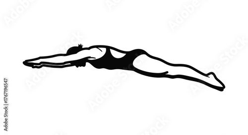 Dynamic silhouette of a swimmer in mid dive capturing the grace and power of aquatic sport