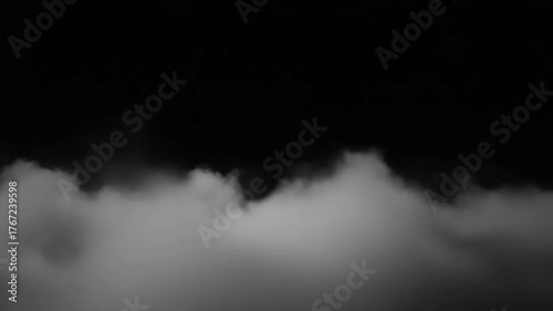 Cloudscape in grayscale: A monochrome captures the raw power of nature. Atmospheric clouds in shades of gray. The image evokes feelings of both calm and intensity.