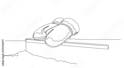 Snow-covered gloves on step in line art style symbolizing winter stillness