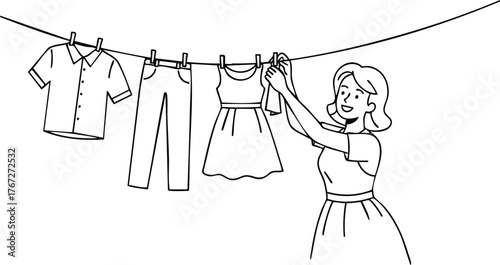 Woman hanging clothes on a clothesline in the sunlight.