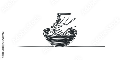 Hands washing with soap and water in a bowl