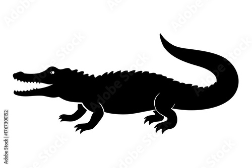 A black silhouette of a fearsome alligator with its mouth open showing sharp teeth and its long tail curved upwards on a white background silhouette