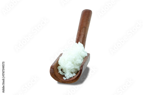 Fleur de sel or flower of salt in wooden scoop isolated on white background stack clipping path close up