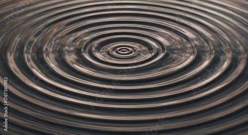 Concentric ripples emanate from the center of a fluid surface reflecting ambient light